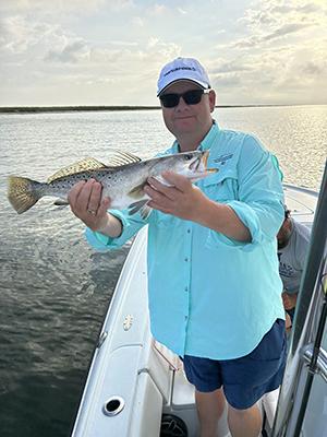 Dr. Sean Powers holding fish