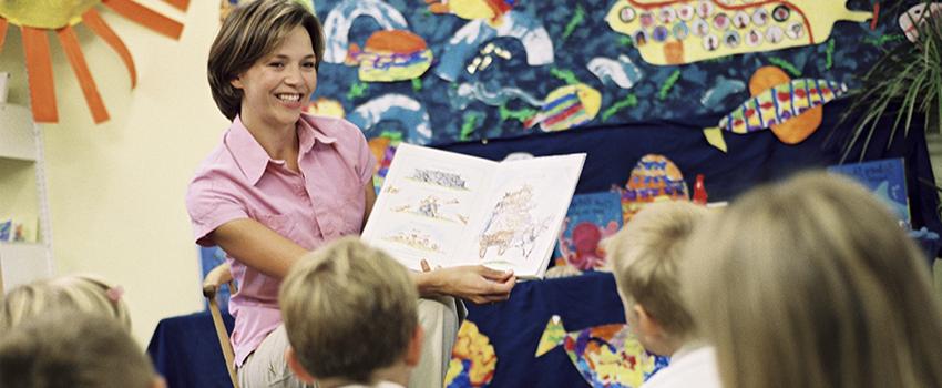 Teacher reading to class.