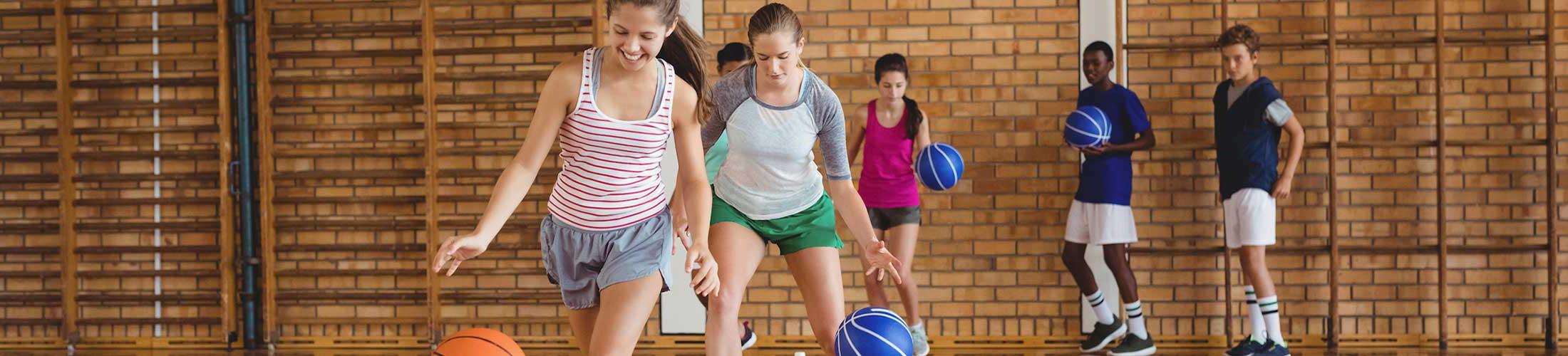 Group of kids playing basketball.